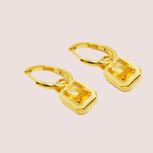 yellow huggie earrings