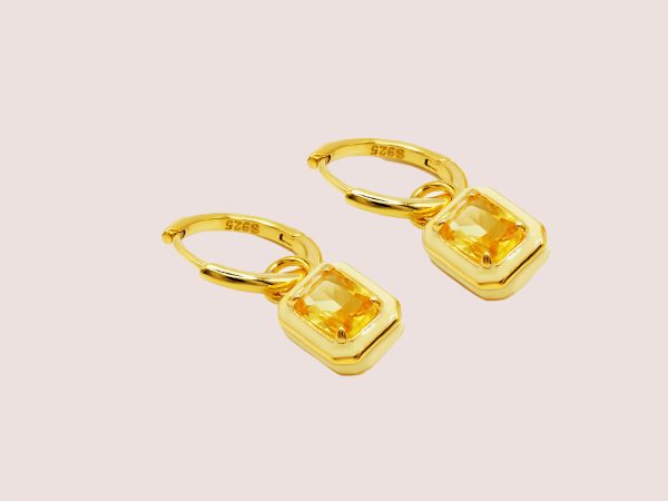 yellow huggie earrings