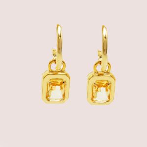 yellow huggie earrings