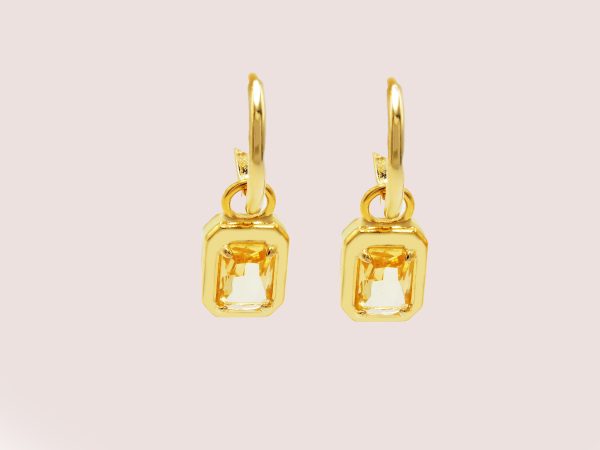 yellow huggie earrings