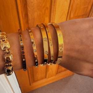 gold bangles on model